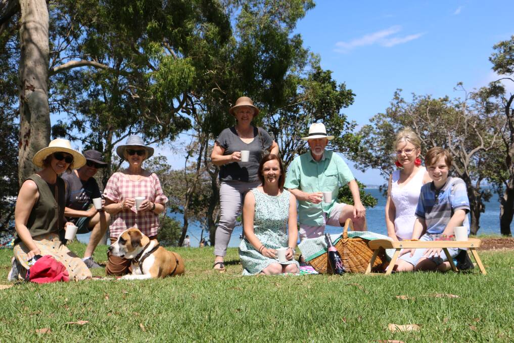 PICNIC-READY: Members of the Climate Action Port Stephens team, with president Alisha Onslow (front centre) prepare for Sunday's picnic at Fly Point in Nelson Bay.