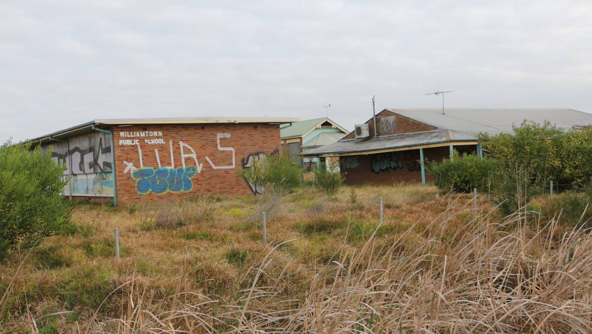SCHOOL SITE: The vandalised former Williamtown Public School site owned by Ed Crawford and awaiting redevelopment.
