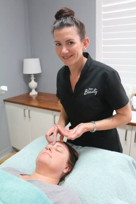 BEAUTY: Bay Beauty's Kellie Pinochet with a client at her Nelson Bay clinic.
