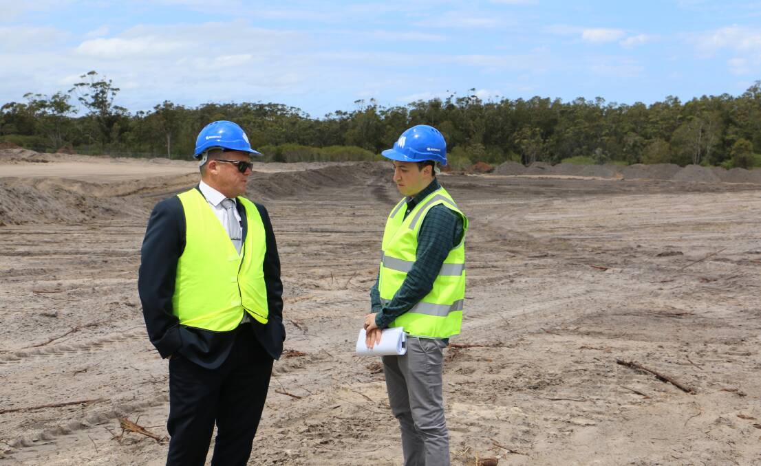 NEW CENTRE: Alex Haxton (left) from PRD Port Stephens in discussion with Harvey Norman national transaction manager Alex Capra at the Taylors Beach site on Wednesday.