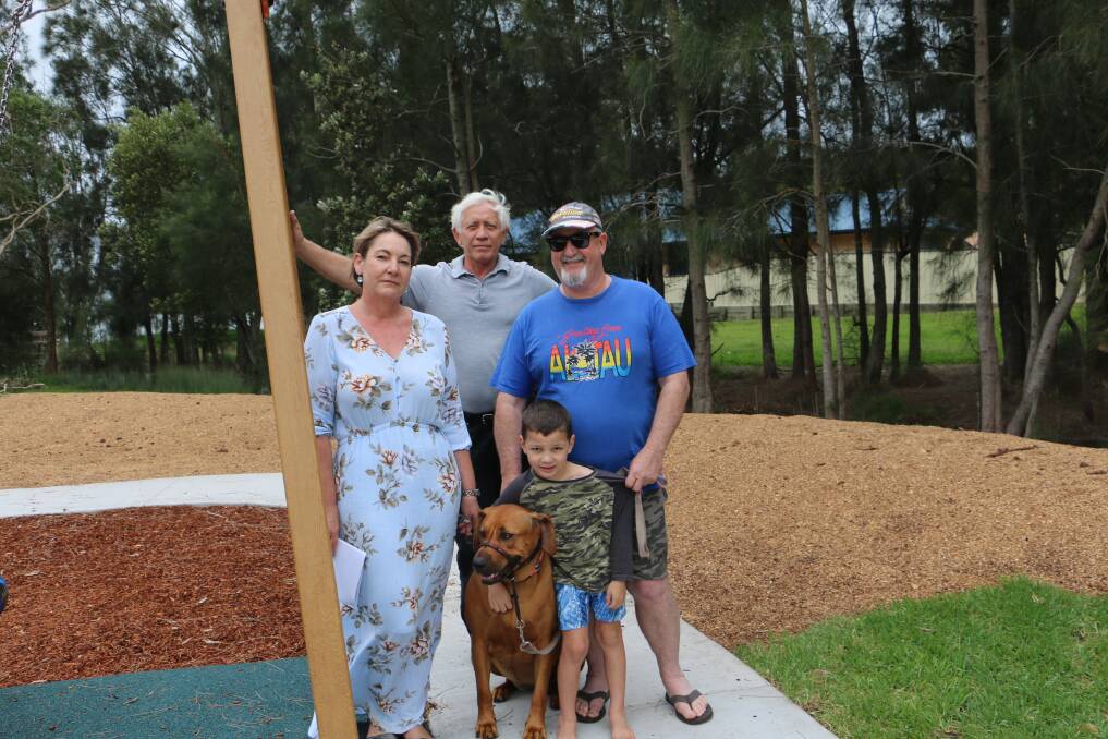 DIVIDED: Deborah Ramage, Ralph de Ville and Garry Wanless with his grandson Blade, 5, and dog Bella at the new Caswell Reserve playground.