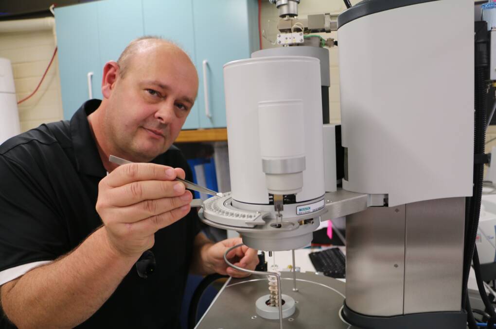 LEADER: Senior researcher Dr Brett Turner analysing some chemicals at the Newcastle Univeristy lab in the centre for geotechnical science and engineering building.