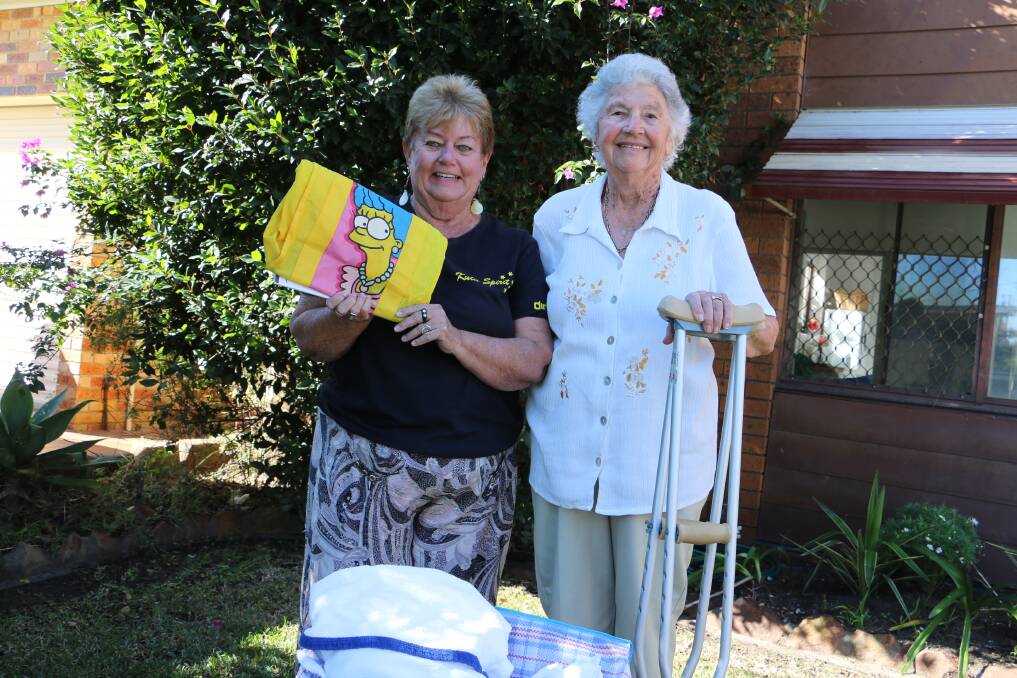 SUPPORT: Wendy Stein accepts items donated by Nelson Bay's Ruth McLeay.