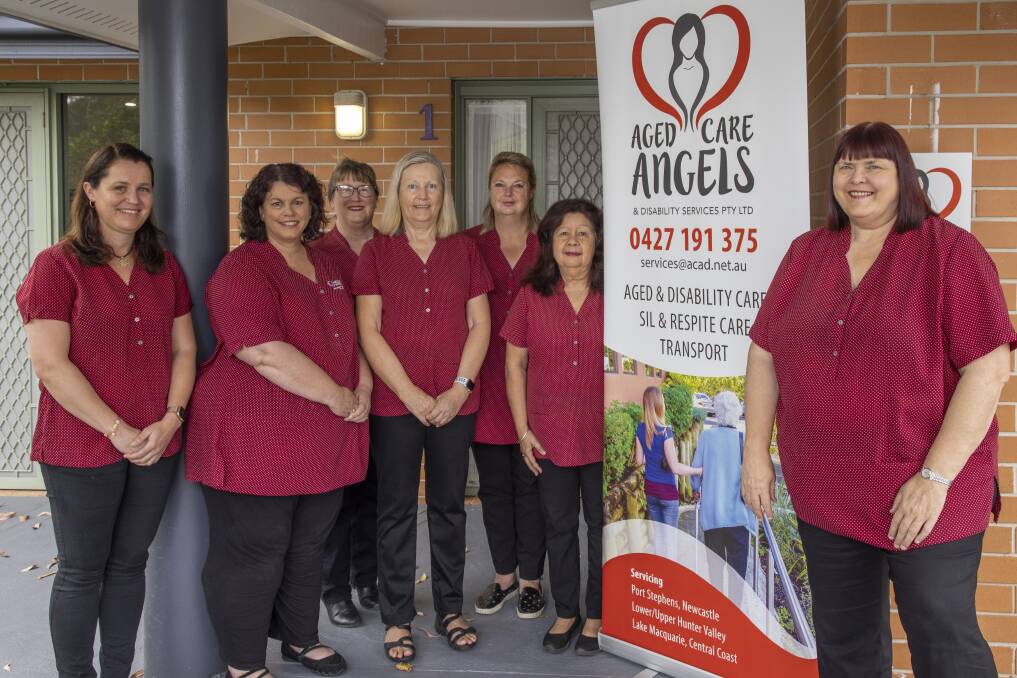 STAFF: Some of the staff from Aged Care Angels and Disability Services at the Salamander Bay home. Picture: Henk Tobbe