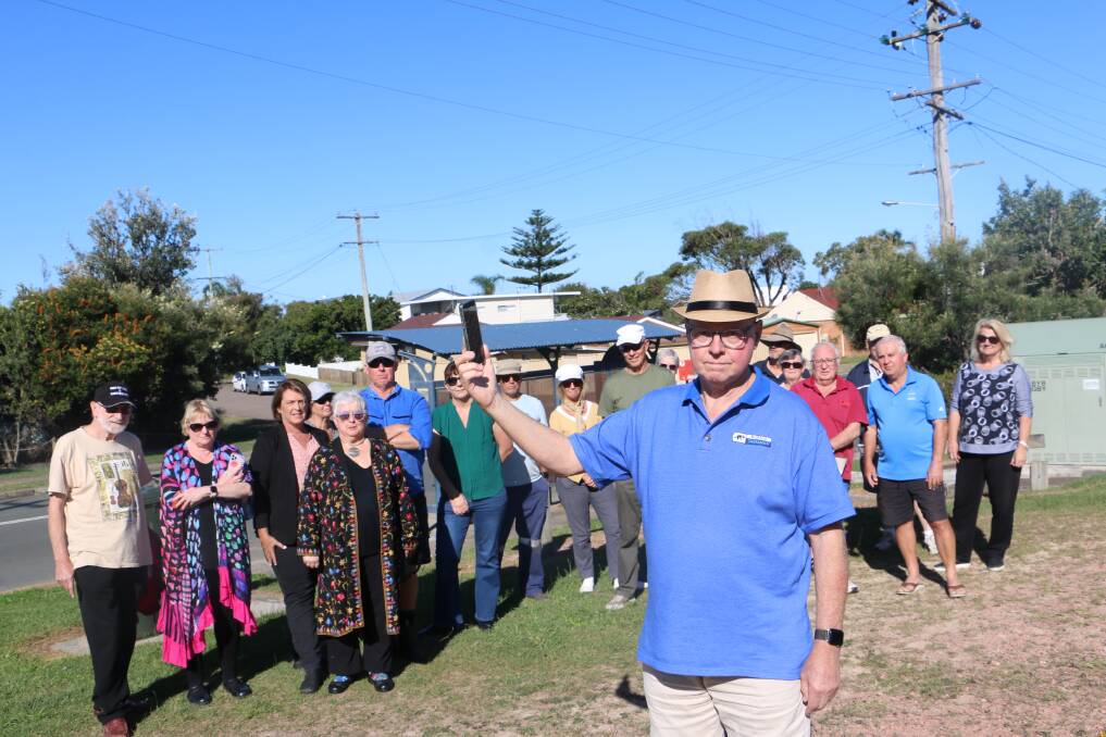 FRUSTRTATED: Chris Muir with long-suffering residents from Boat Harbour and surrounds waiting for an upgrade to their mobile phone coverage.