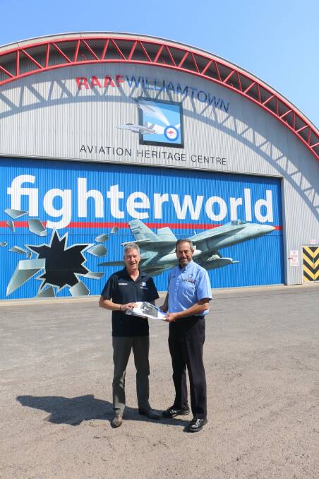 HAND OVER: Incoming manager Bernie Nebenfuhr, left, with outgoing manager Terry Wells at the Fighter World museum in Medowie Road, Williamtown.