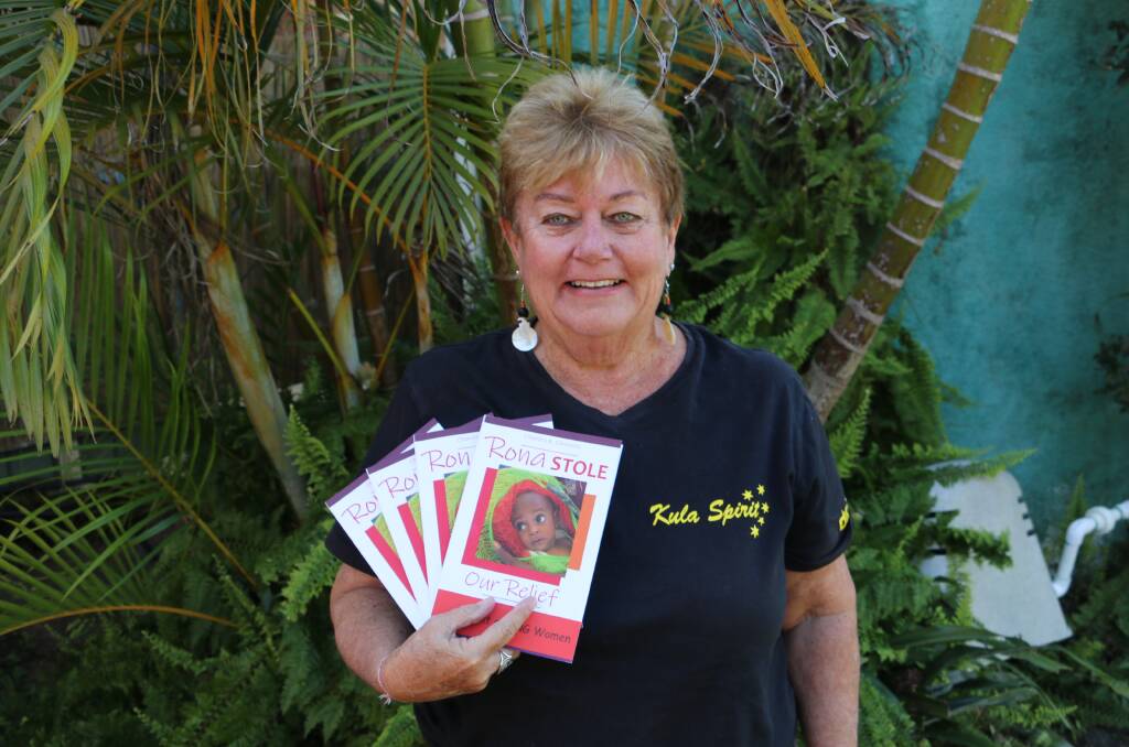 FUNDRAISER: Port Stephens grandmother Wendy Stein with copies of her fundraising boo, 'Rona Stole our Relief' at her Taylors Beach home.