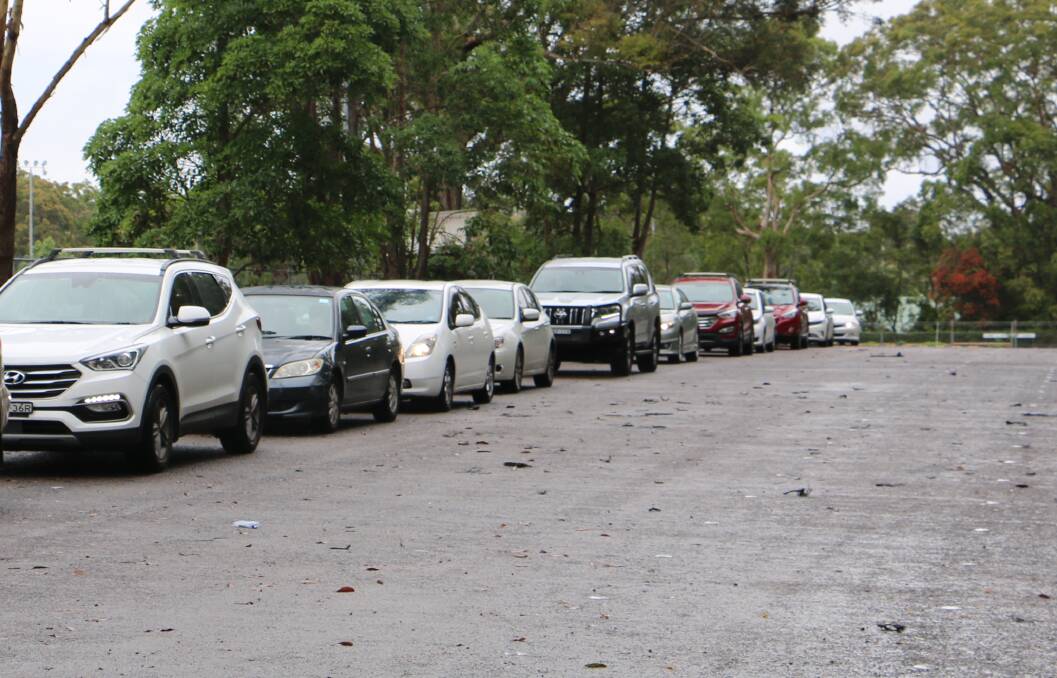 LINED UP: Vehicles queuing up at the Nelson Bay drive through testing clinic on Monday morning.