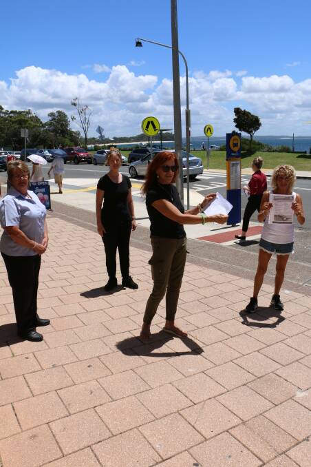 PETITIONERS: Shoal Bay business owner Helen Love (centre) and residents who are opposed to the parklets in their shopping strip.