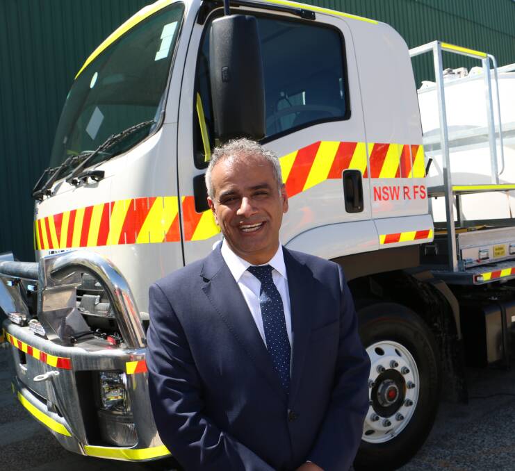 GLOBAL CITIZEN: UAE Ambassador, H.E. Abdulla Al Subousi, in front of one of the seven fire trucks at Varley's Tomago plant.