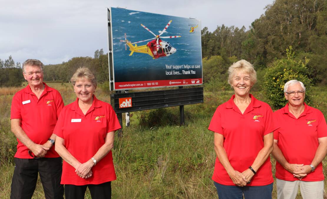 SERVING THE COMMUNITY: Port Stephens WRHS volunteers Norm Cousins, Jayne Cousines, Margaret Wilbrow and Rob Wilbrow at the Anna Bay billboard.