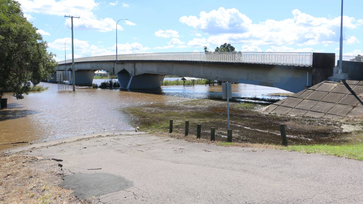 WATER UNDER THE BRIDGE: The deluge was contained at Raymond Terrace away from the town centre and business district.