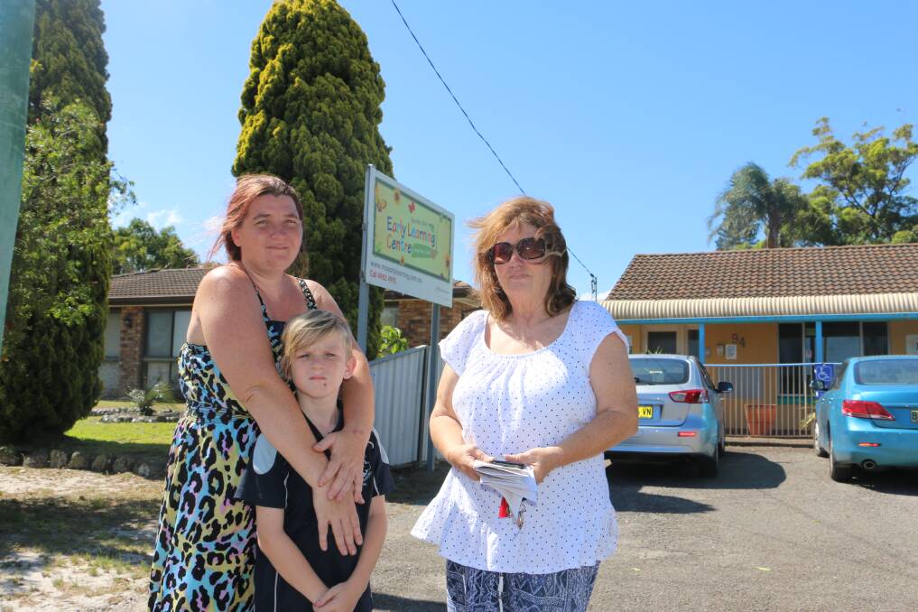 UNCERTAINTY: Amy Straker with son Josh, 9, and Vicki James outside the Tanilba Bay Early Learning Centre due for closure on March 15.