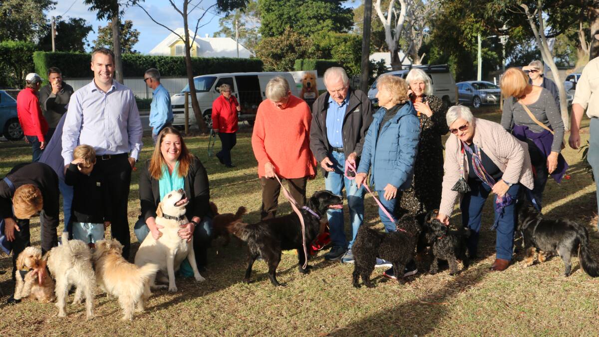 A DOG'S LIFE: Mayor Ryan Palmer and Cr Jaimie Abbott with some of the many dogs and their owners at the opening of the off-leash dog area at Soldiers Point's Lancaster Park.