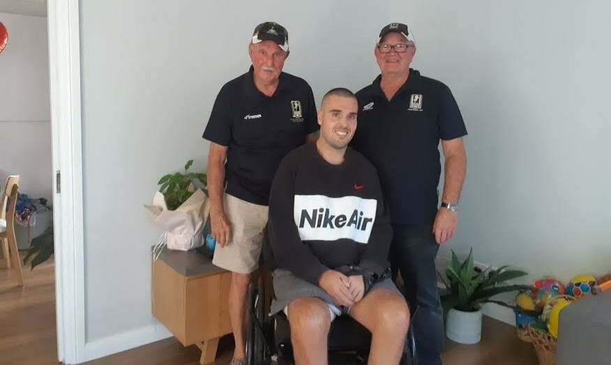 DRIVEN: Chris Poulos was recently visited at his home by Port Stephens Men of League directors Peter Arnold (left) and Chris Kelly. Picture: Supplied