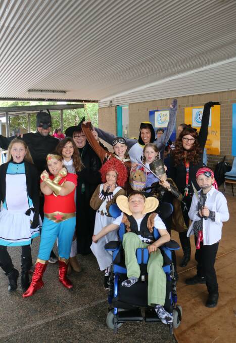 DRESSING UP: Students and staff from Tomaree Public School in costume for last Friday's Book Week celebrations.