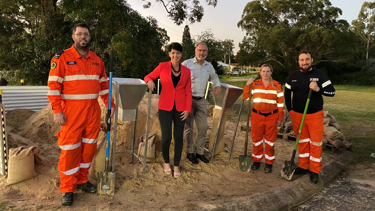 ASSIST: Kate Washington with Port Stephens SES and Ampcontrol staff doing some sand bagging with the steel framed units. Picture: Supplied
