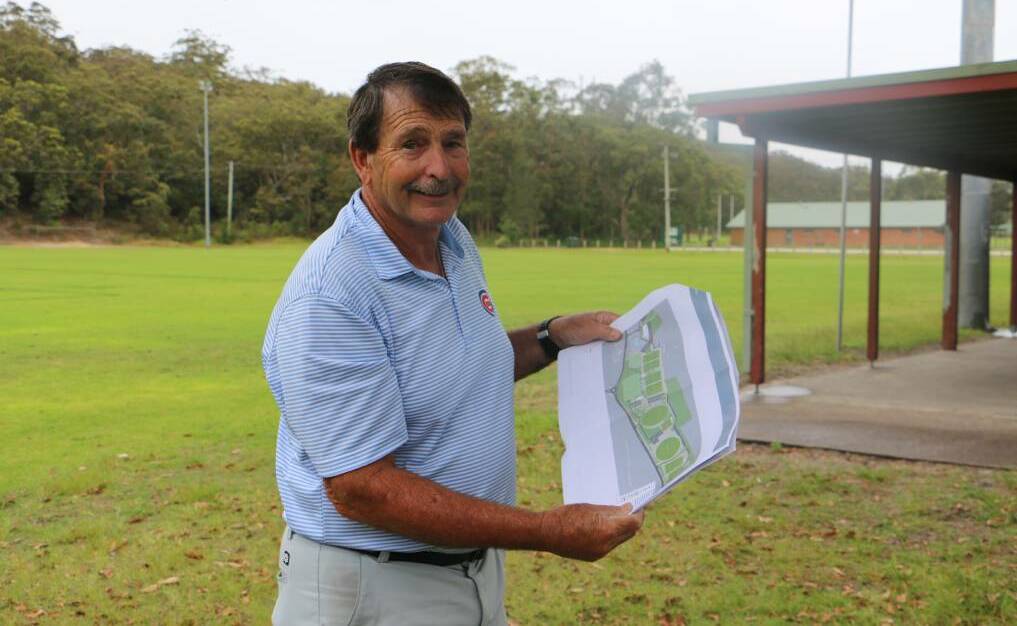 VISION: Tomaree Sports Council president Bruce Scott with original plans for the construction of a new clubhouse at the multi-use sporting complex.