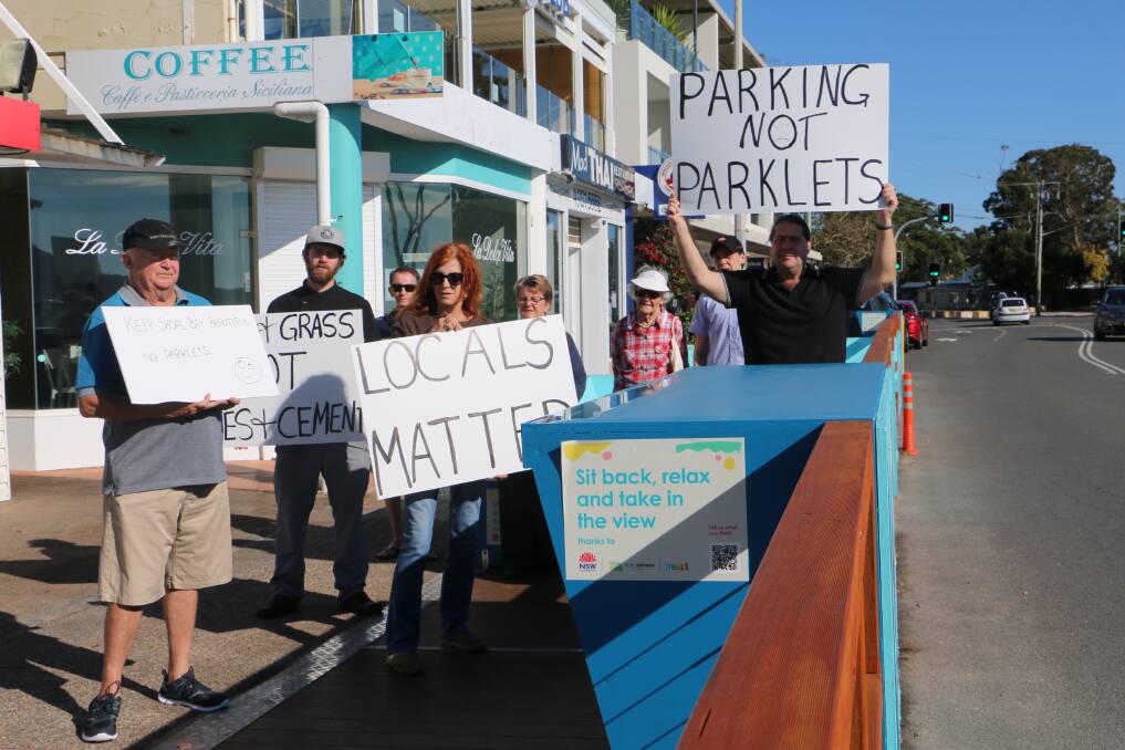 ANGRY: Business owners and residents of Shoal Bay are calling for removal of the parklets and the reinstatement of car parking spaces along their shopping strip.