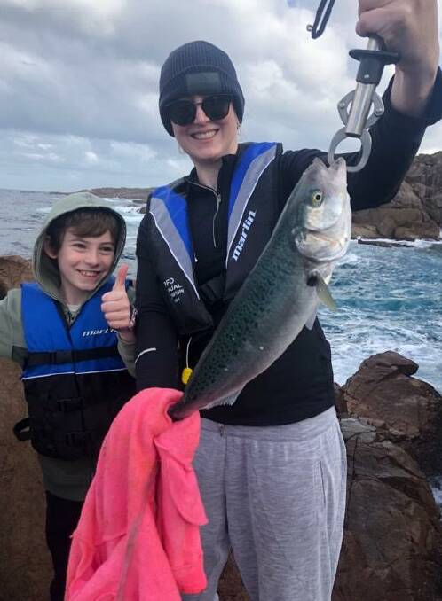 SUPPORT: Port Stephens angler Hayley Coleborne with her son, Jackson, fishing from the rocks at Boat Harbour. Hayley is a strong advocate for lifejackets whilst rock fishing. Picture: Supplied
