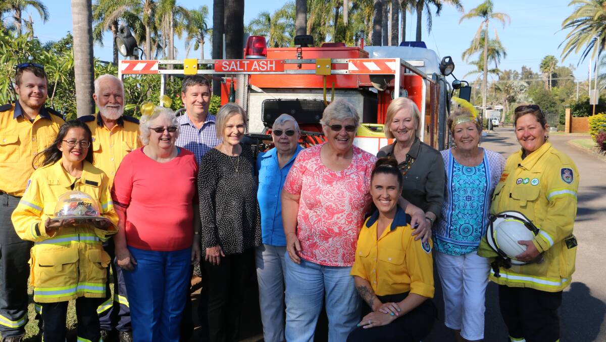 DONATION: Members of the Banksia Grove village committee with volunteers from the Salt Ash Rural Fire Brigade at the Biggest Morning Tea cheque presentation.