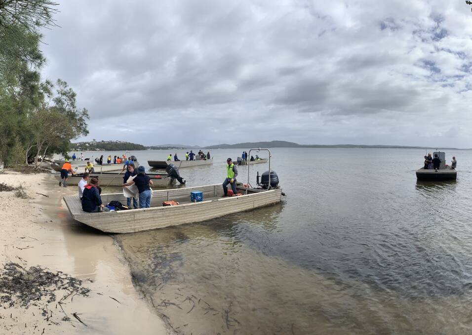 HEADING OUT: Forty-eight Port Stephens oyster farmers took part in a mass clean-up of the foreshore at Salamander Bay last Wednesday. Pictures: Supplied
