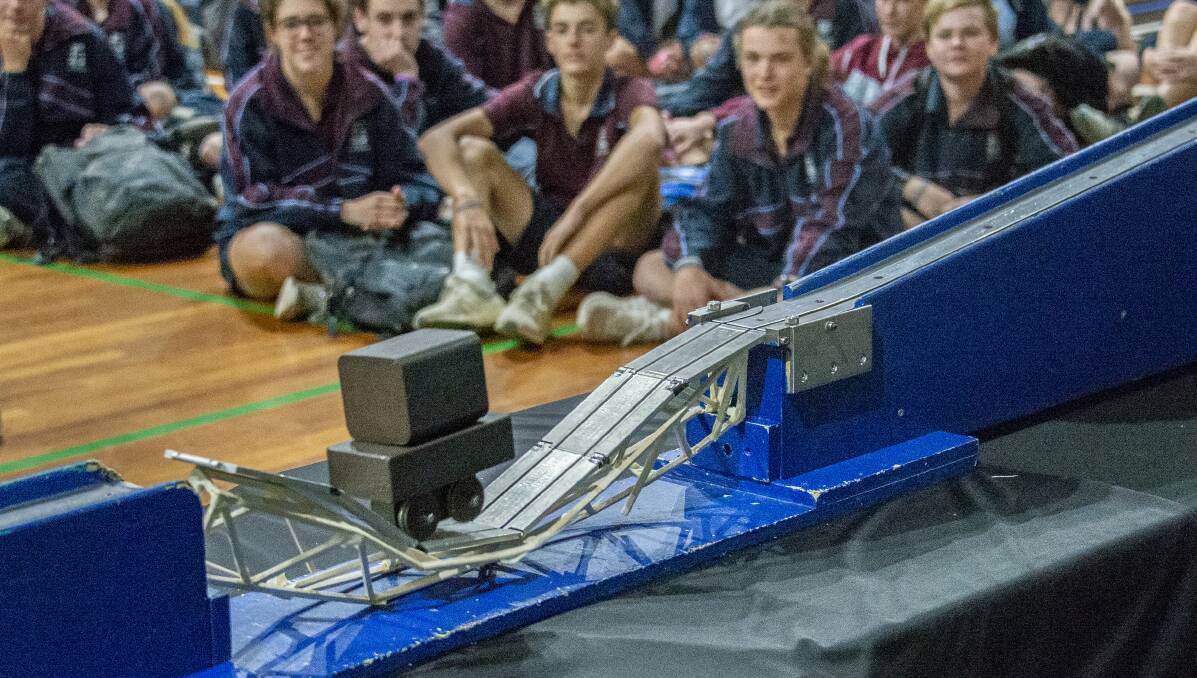 CONSTRUCTION: Students from Medowie Christian School watch on while bridges are tested for weight bearing capacity. Picture: Supplied
