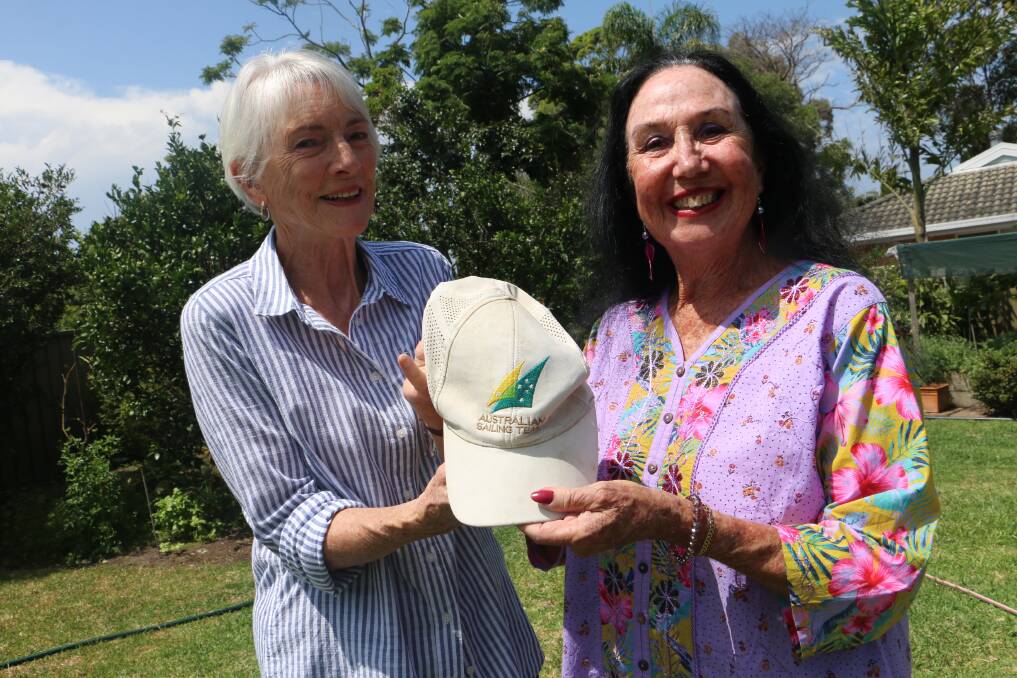 REUNITED: Amanda Sutherland (right) returns Michael Blackburn's cap to his mum, Judy Cresp, from Salamander Bay.