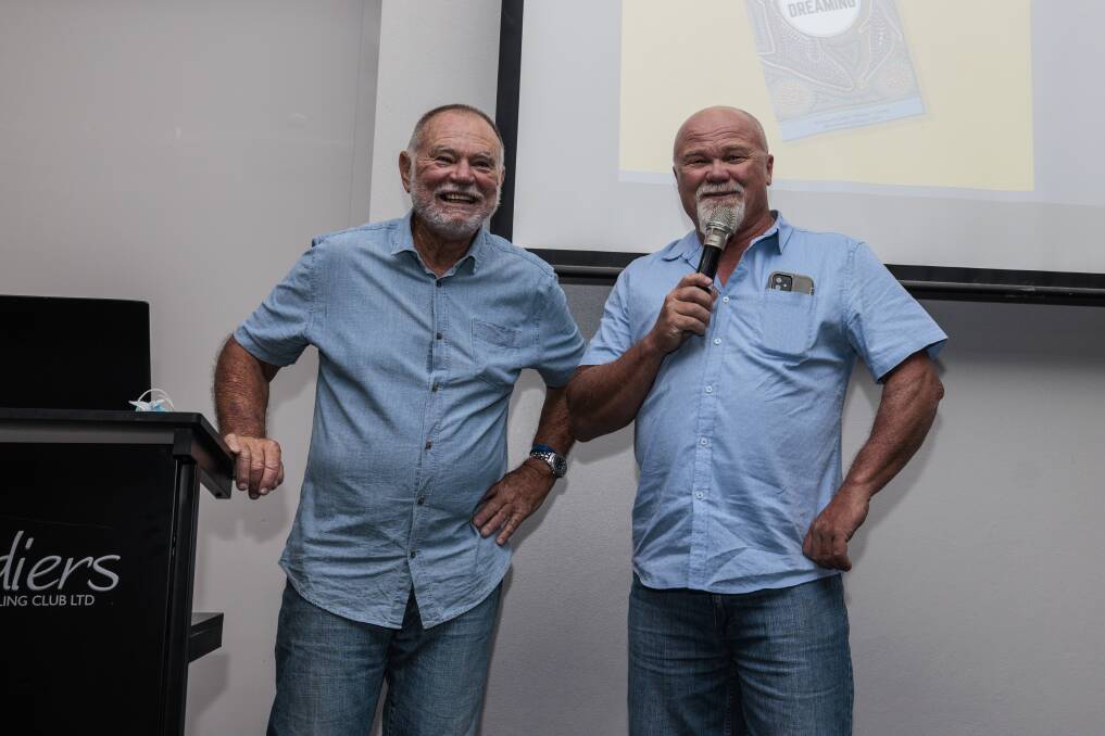 ALL SMILES: John Clarke with fisherman George Trinkler at the book launch held at Soldiers Point Bowling Club. Picture: Henk Tobbe