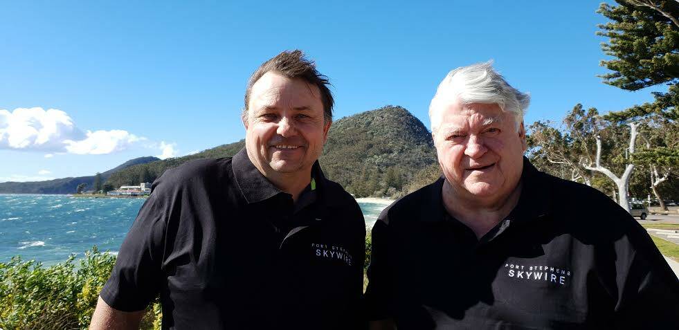 UP UP & AWAY: Two of the brains behind the Skywire are Paul Tyszyk and Michael Mace, pictured in front of the Tomaree Headland. Picture: Supplied
