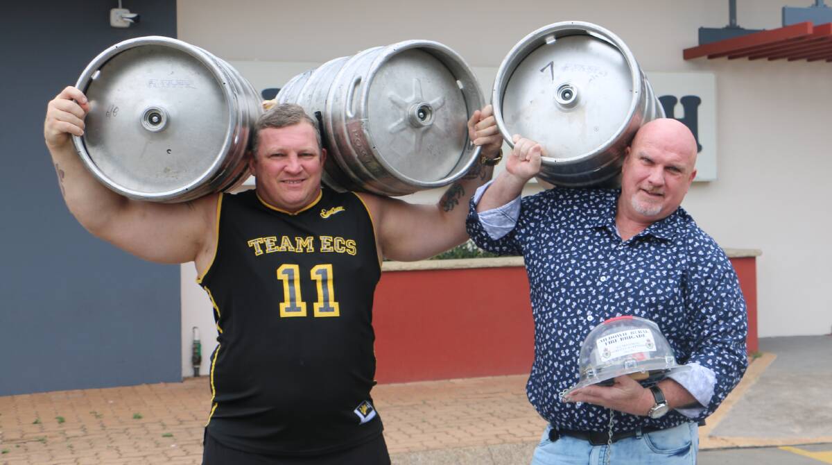 STRONGMEN: Benny Chessum and councillor Chris Doohan in practice for the strongman events to take place at the Medowie Bull 'n' Bush Hotel on January 25.