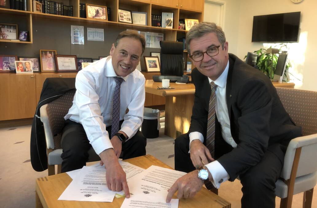 DELAY: Federal MP David Gillespie with Health Minister Greg Hunt preparing for the vaccine rollout. Picture: Supplied