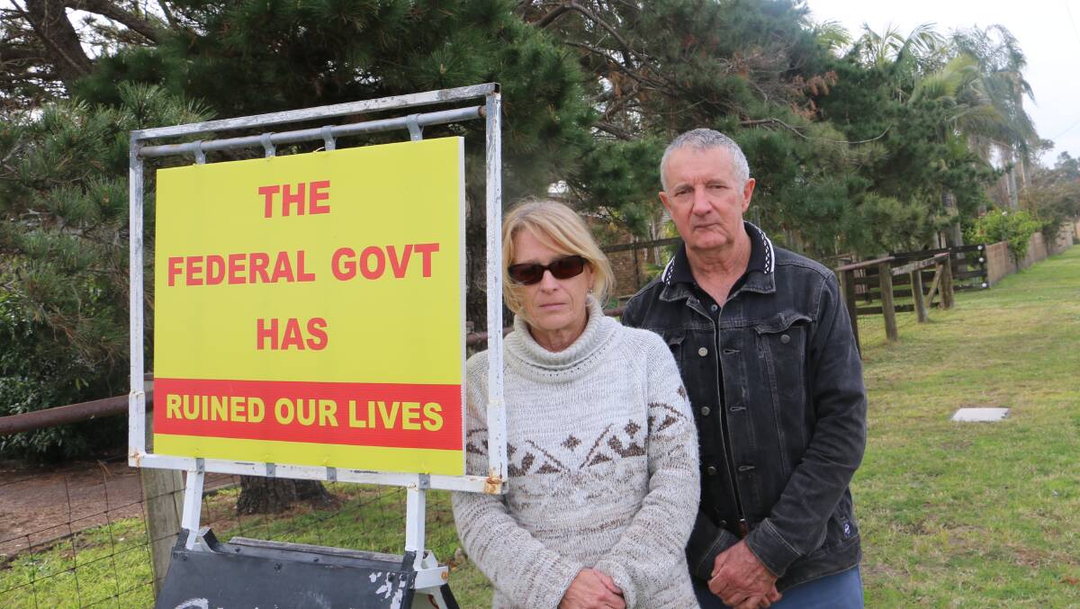 LIVES 'RUINED': Lindsay Clout, president of the Coalition Against PFAS, with resident Sue Walker outside Mr Clout's Fullerton Road property.