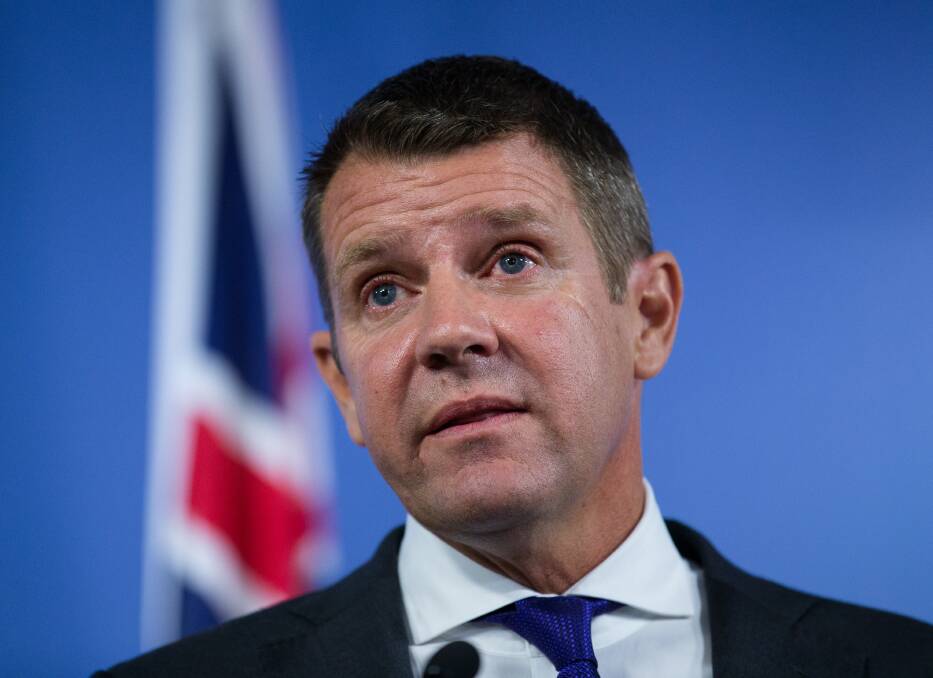 Outgoing: Premier Mike Baird is emotional at a press conference announcing his resignation in Sydney. Picture: Janie Barrett