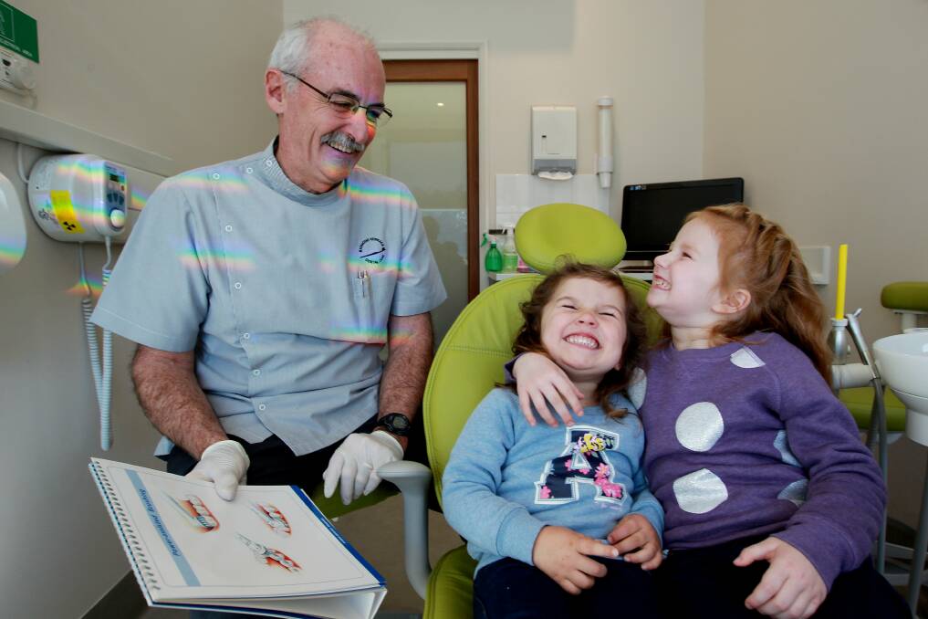 Raymond Terrace dentist Dr Chris Wilson with sisters Isabella and Madalane Connolly. 