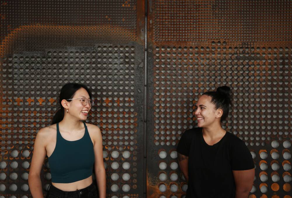 Giving: Felicity Cheng, with Demi Cheetham, originally wanted to be a history teacher in a rural community. "From a young age it was drilled into me that with privilege comes a responsibility to give back, to use what you've been given to give everyone else a chance." Picture: Simone De Peak