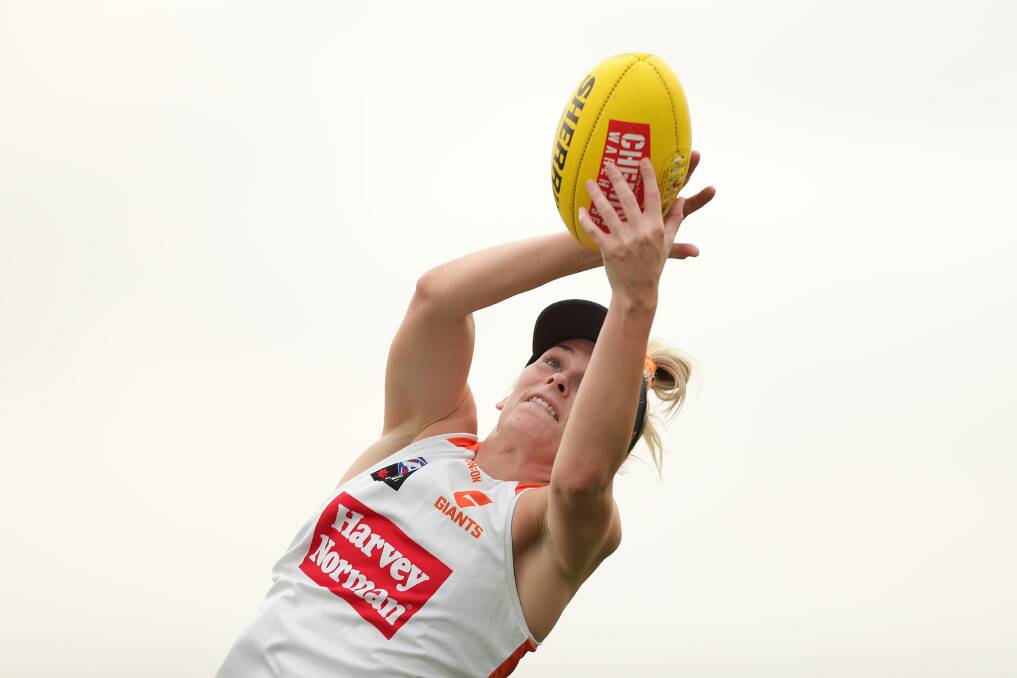 FULL FLIGHT: Nelson Bay's Lisa Steane takes a mark at Giants pre-season training in Sydney. She's aiming to make her AFLW debut in 2020. Picture: Getty Images