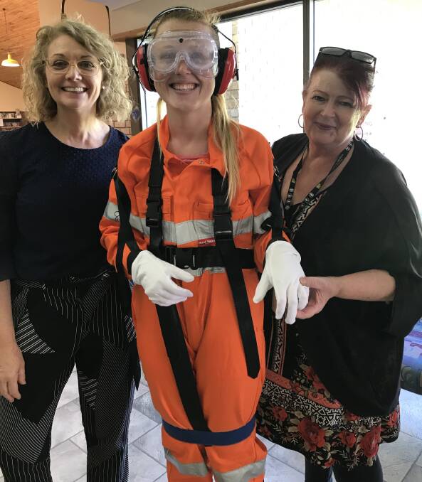 SUITS YOU: Support worker Ashlee Wirth in an empathy suit with trainers Julie Mettyear and Sue Smart.