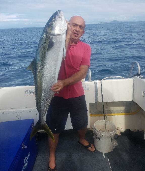 BIG ONE: Milan Ivankovic struggles with his 15kg Broughton Island kingfish.