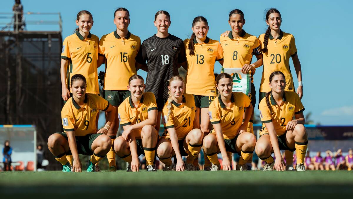 Adamstown 14-year-old Caoimhe Bray (third from left in back row) and Toronto 16-year-old Emma Dundas (third from left in front row) started for Australia at the AFC U17 Asian Cup in Bali on Tuesday. Picture Ann Odong/Football Australia