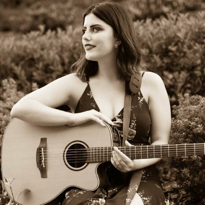 Whimsical mayhem: With acoustic guitar in hand, singer-songwriter, Sarah Christine brings here own brand of whimsical mayhem to the Anchorage Port Stephens on Sunday.

