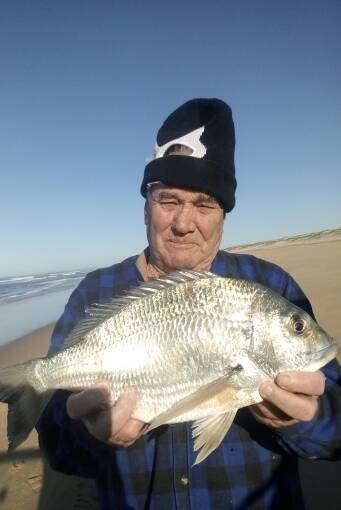 Winter bream on the move: Stockton beach champ Schoie with his 2 kilogram bream. Photo supplied.