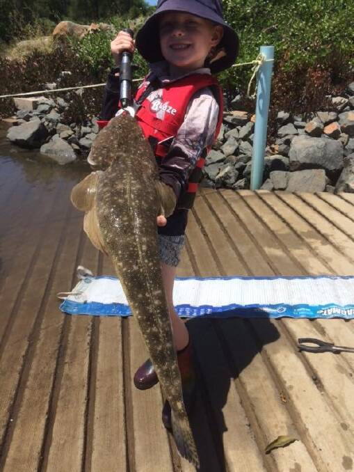 FROM THE SEA GRASS MEADOWS: Six-year-old Medowie champ Kyle Walker with his thumping dusky flathead. Picture: supplied.