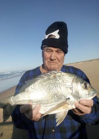 Magnificent: Stockton beach champ Schoie with his two kilogram bream. Stinker says now is the time to chase a winter bream. Photo supplied. 