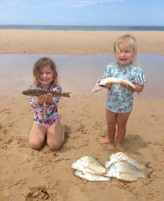 HOOKED: Boat Harbour champs Bonnie and Evie Preston with Stockton Beach whiting caught on worms. Picture: Supplied.