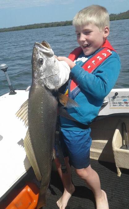 CATCH OF THE DAY: Eight-year-old Salt Ash youngster Marshall Challen with his eight kilogram mulloway caught in Tilligerry Creek on soft plastic. Pictured: Supplied.