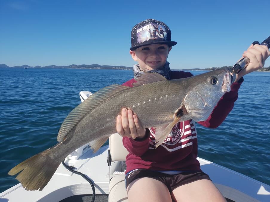FAMILY OF FISHERS: Grandson of well-known Port Stephens fisherman Wayne Coles, 10-year-old champ Rylan Coles with one of his mulloway. Picture: supplied.