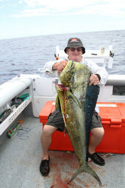 GAME ON: Troy Parrot revels in the game fishing season, landing a 15 kilogram dolphinfish off the northern edge of the local reef system. Picture: Supplied.
