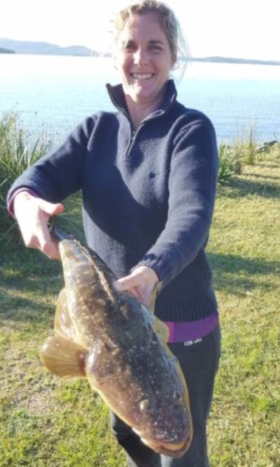 LANDED: Karen Croker with her 70 centimetre flathead caught using live nippers for bait, at ‘Rocks a Wash’, Soldiers Point. Photo supplied.