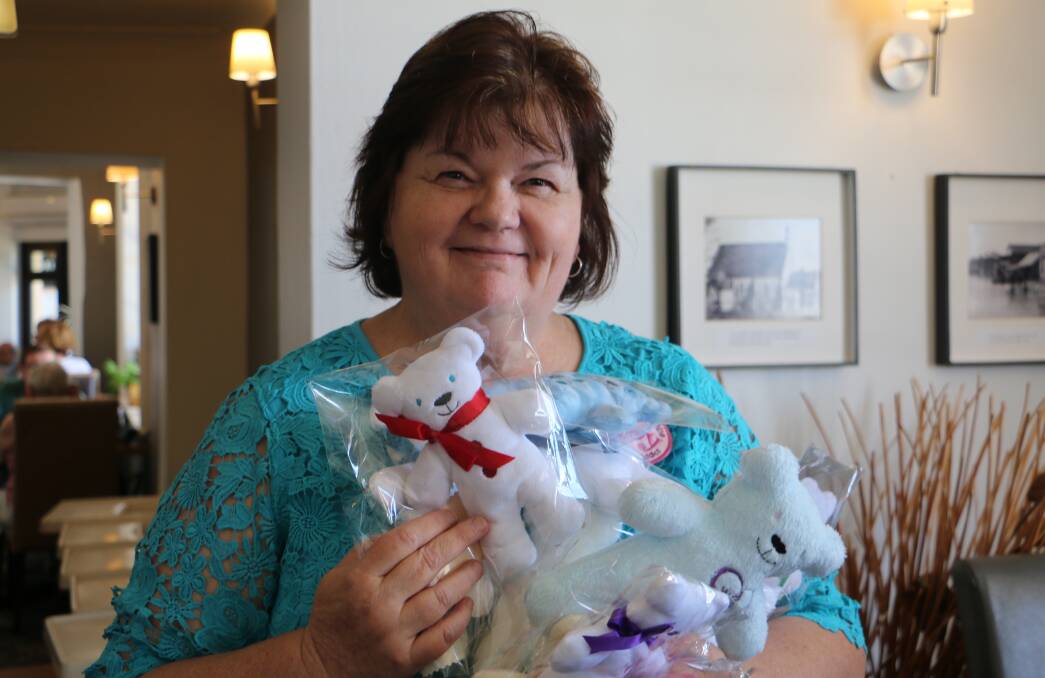 TEDDYS: Joy Davies, Raymond Terrace, holding some of the 5,000 teddy bears that have been made by the 'Pay It Forward' group. Picture: Kia Woodmore.